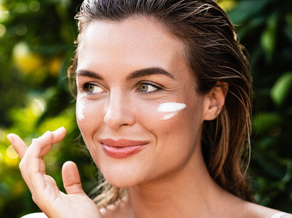 woman with sun cream on her face