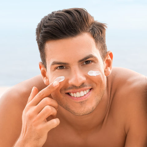 man applying sun cream